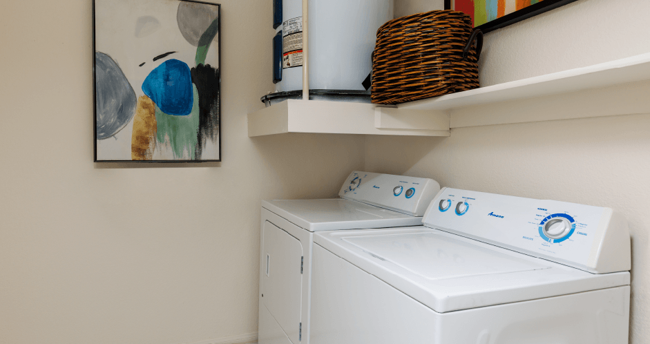 the washer and dryer in the laundry room of a home